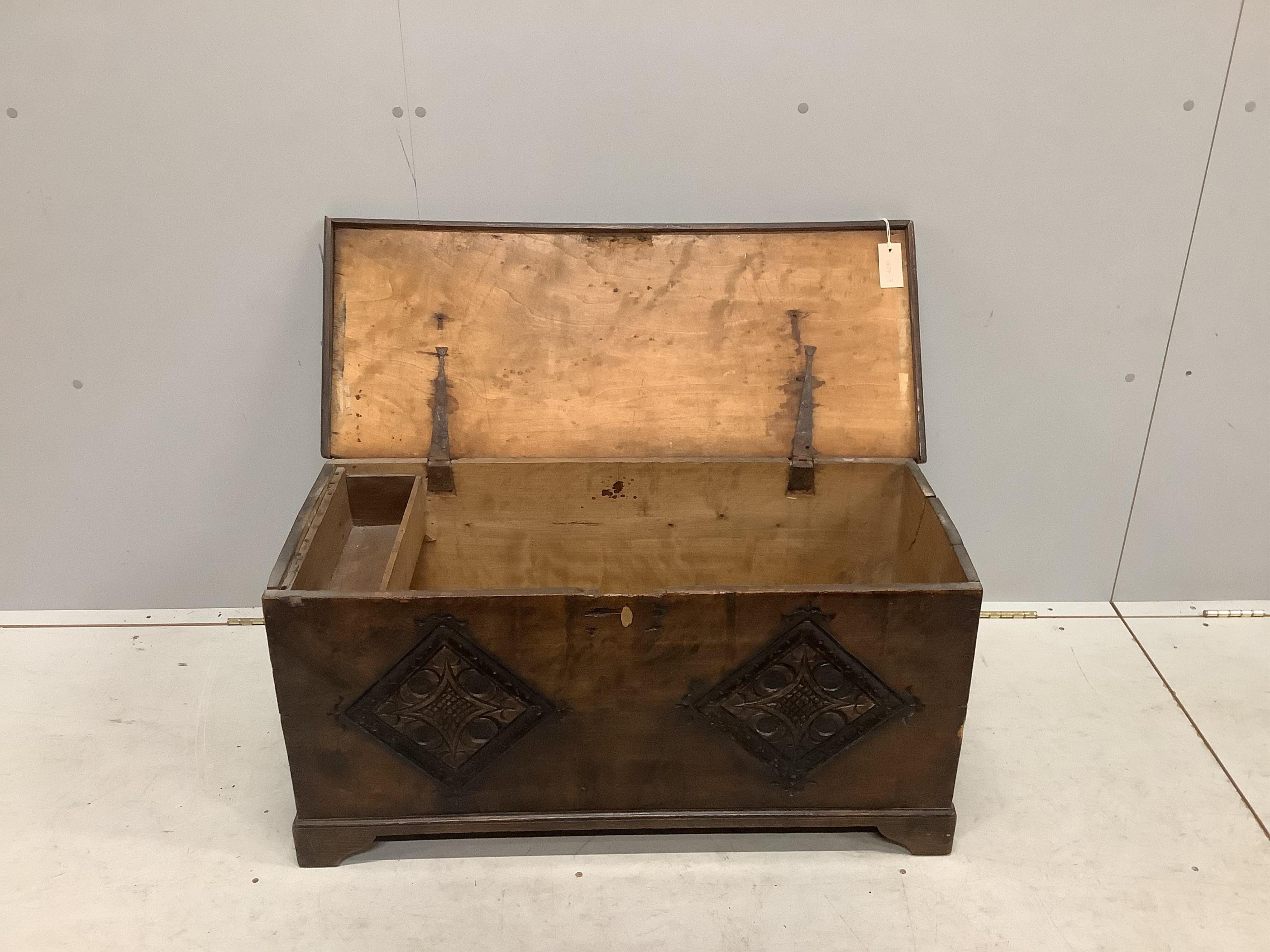 A small 17th century style carved fruitwood six plank coffer, width 91cm, depth 38cm, height 46cm. Condition - fair